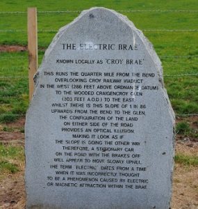 electric brae stone sign by the side of the road